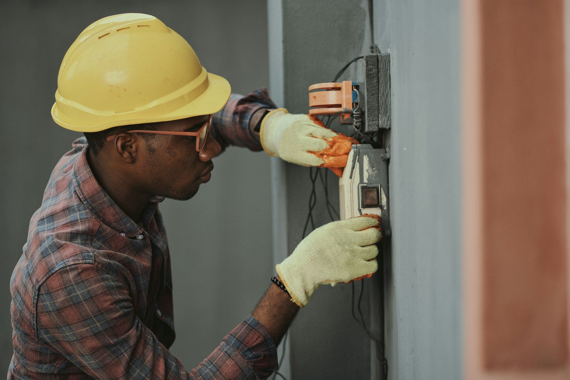 Professional electrician working on a residential electrical panel